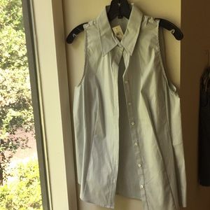 Sleeveless collared button down blouse